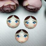 Matryoshka Doll Face Glass Cabochon with Flat Back, White Skin Tone, Brown Hair, Blue Eyes